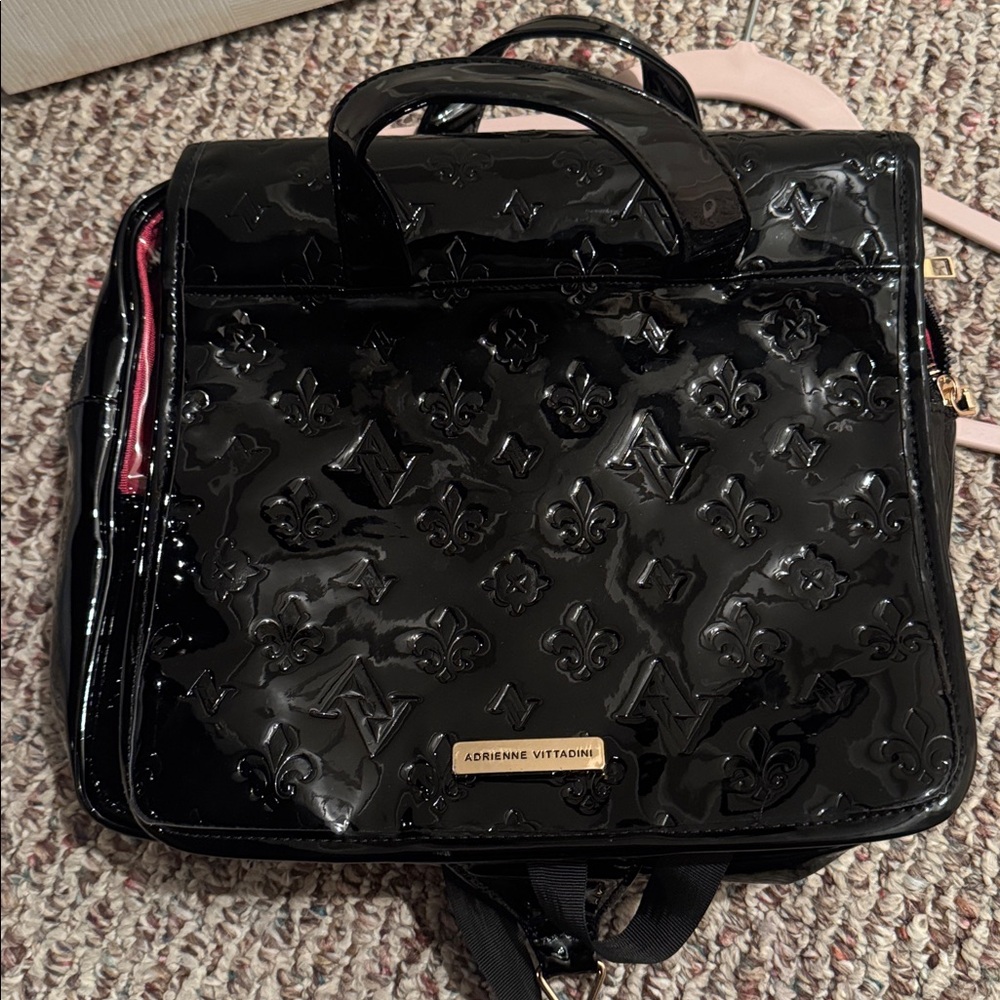 Adrienne Vittadini hanging travel toiletry bag, used for cosmetics/skincare.